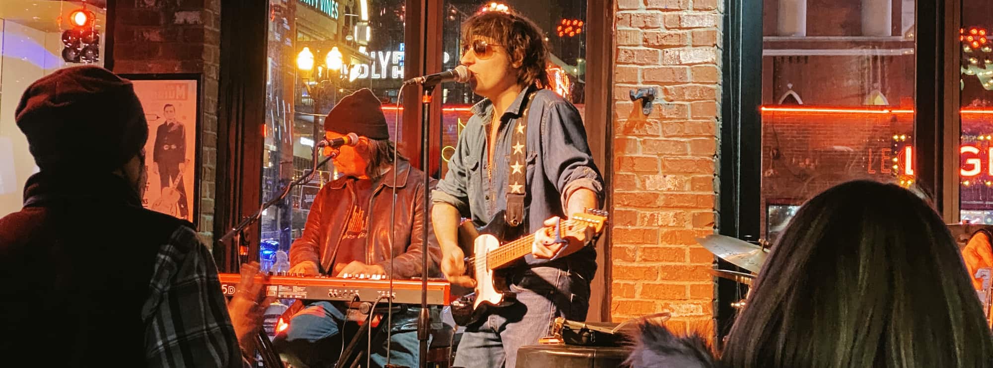 bar singer on guitar in Fayetteville